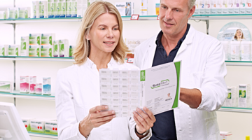 Pharmacists reading SureMed pack